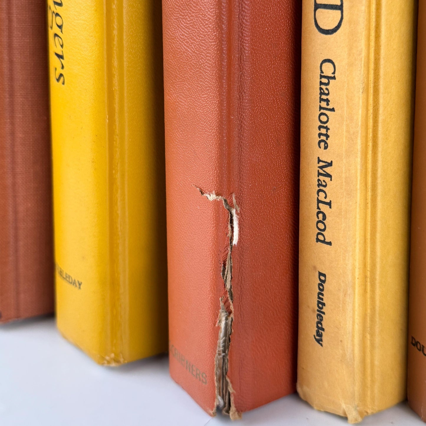 Vintage Copper Mustard Terra Cotta Orange Books for Retro 1970s Shelf Styling and Staging