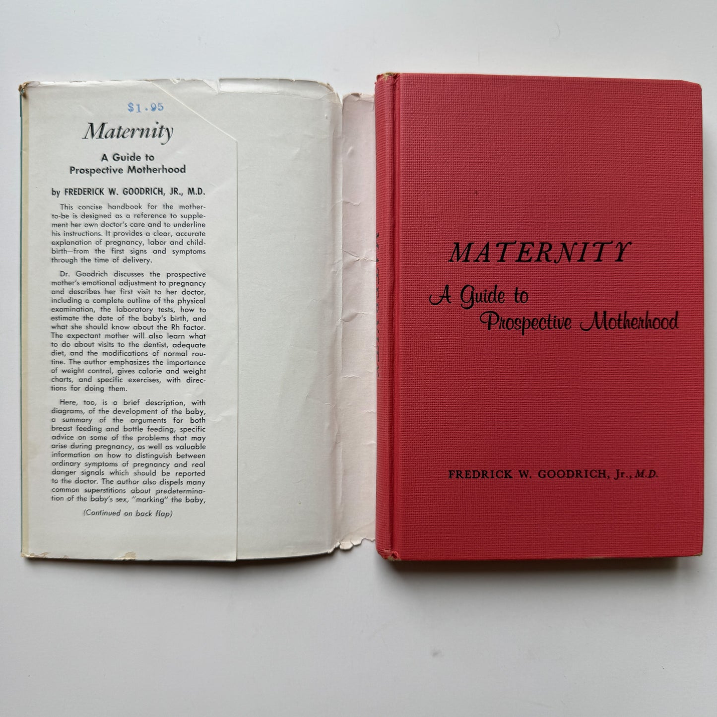 Red book titled 'Maternity: A Guide to Prospective Motherhood' by Frederick W. Goodrich Jr., M.D., open to a page.