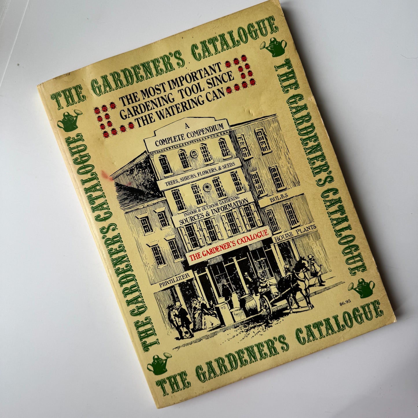 Vintage-style 'The Gardener's Catalogue' book on a white background
