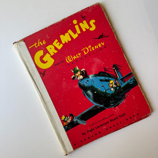 Vintage book titled 'The Gremlins' from Walt Disney on a white background