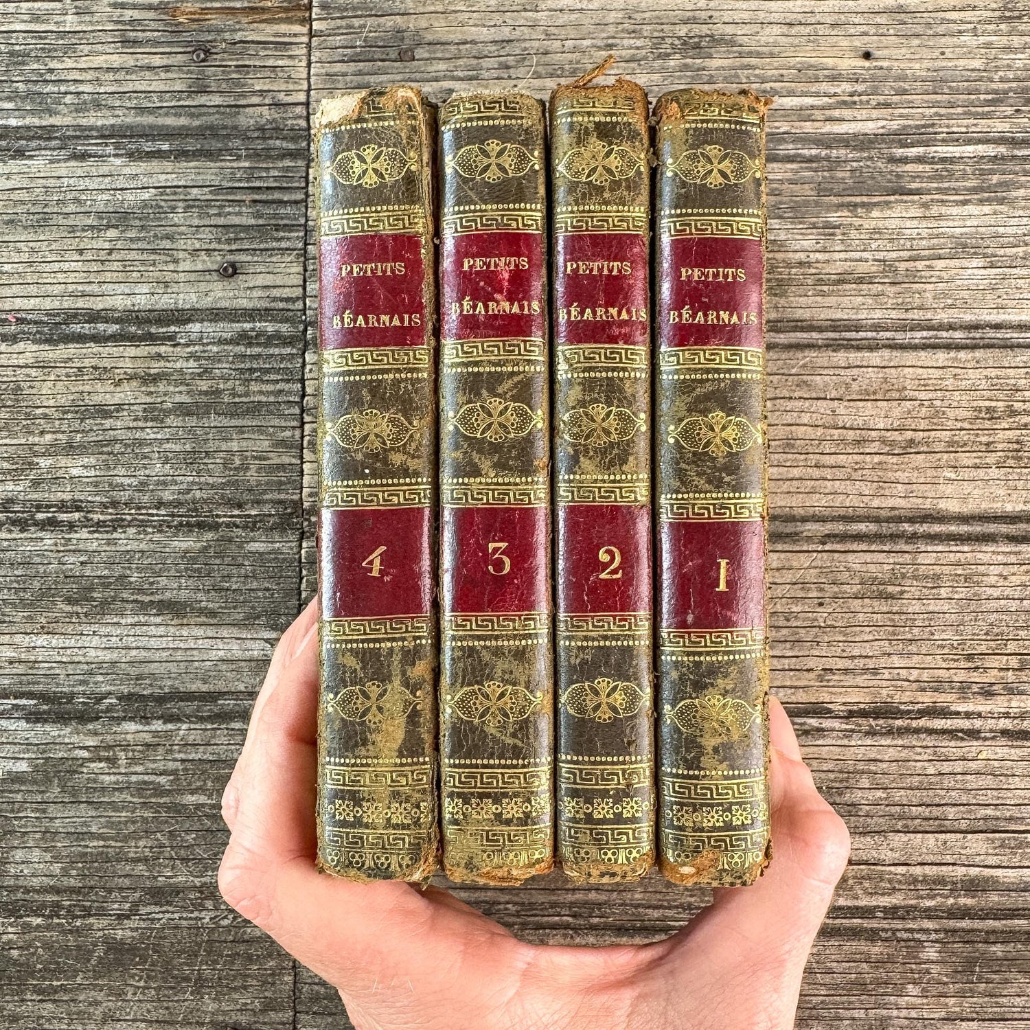 Antique Gold, Black, and Red French Leather Book Set of Les Petits Béarnais by Delafaye, 1824, 4 Volumes